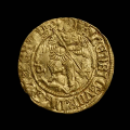 a_photo_of_a_gold_coin_with_a_figure_slaying_a_dragon.png